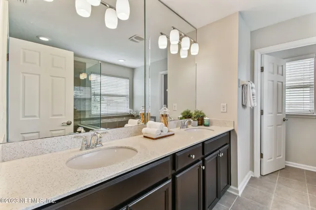a bathroom with a tub and a window