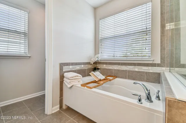 an aerial view of house with outdoor space and swimming pool
