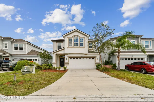 a kitchen with stainless steel appliances granite countertop a sink stove and microwave