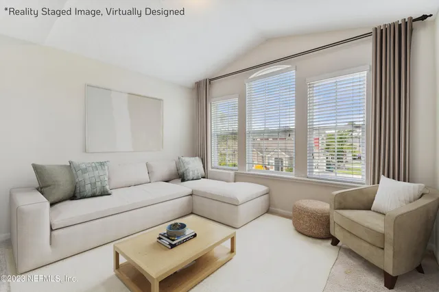 a bathroom with a tub a sink and a large window