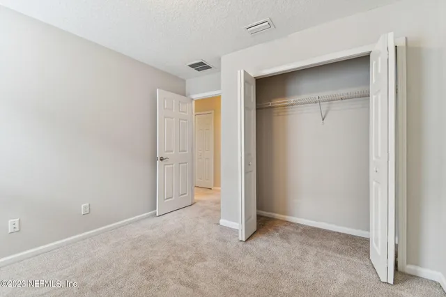 a view of a swimming pool with a table and chairs