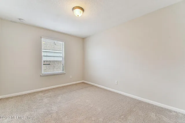 an aerial view of a swimming pool patio and outdoor seating