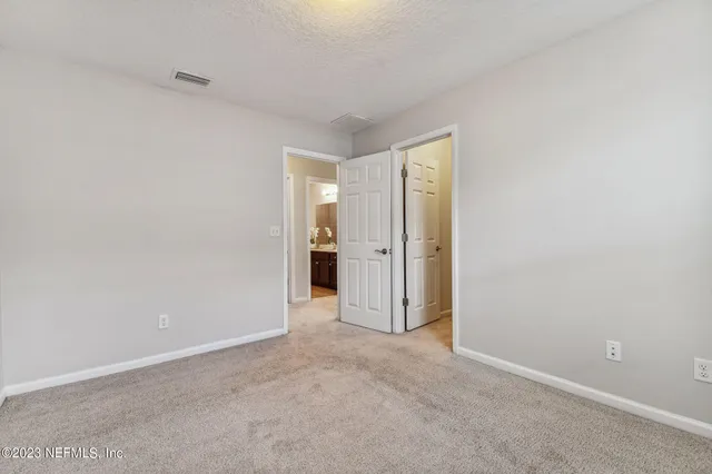 an aerial view of residential houses with outdoor space and street view