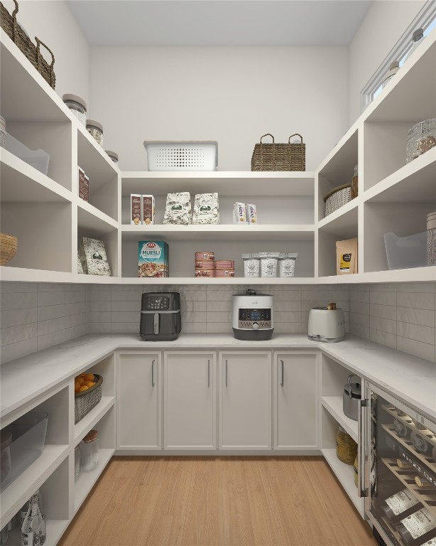 1002 East 25th Street Houston, TX 77009 - Photo 12 of 45 a view of a kitchen with cabinets and wooden floor