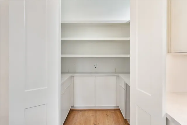 a bathroom with sinks mirror and bathtub