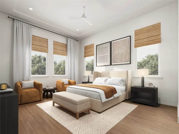 a bedroom with a large bed and a potted plant