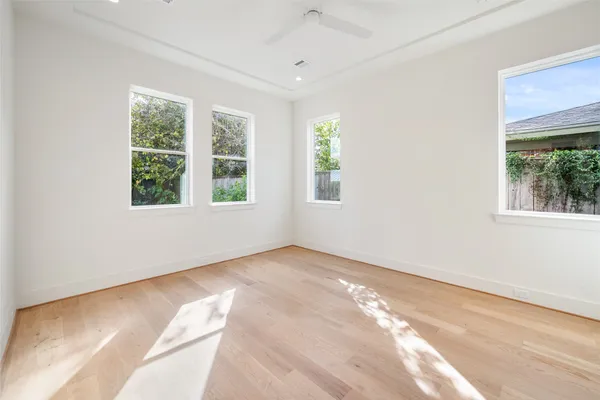 a living room filled with furniture and a flat screen tv