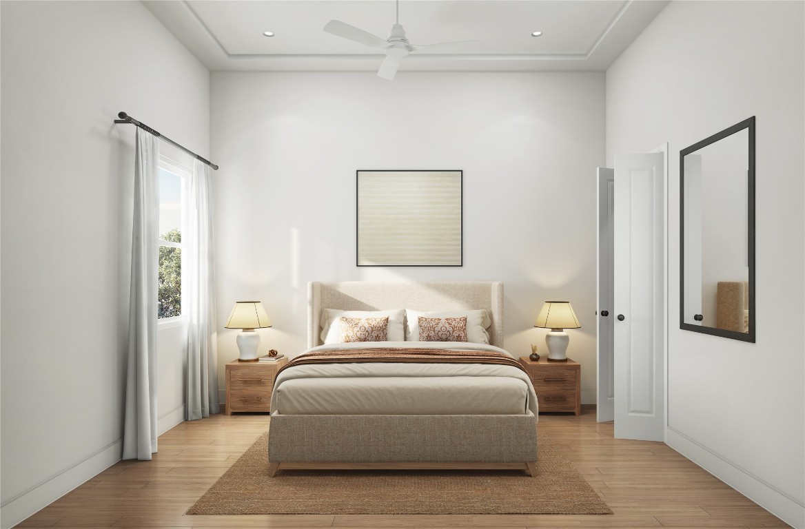 1002 East 25th Street Houston, TX 77009 - Photo 37 of 45 a bedroom with a bed and a painting on the wall