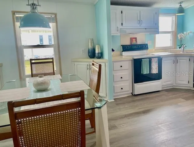 a view of kitchen with wooden floor