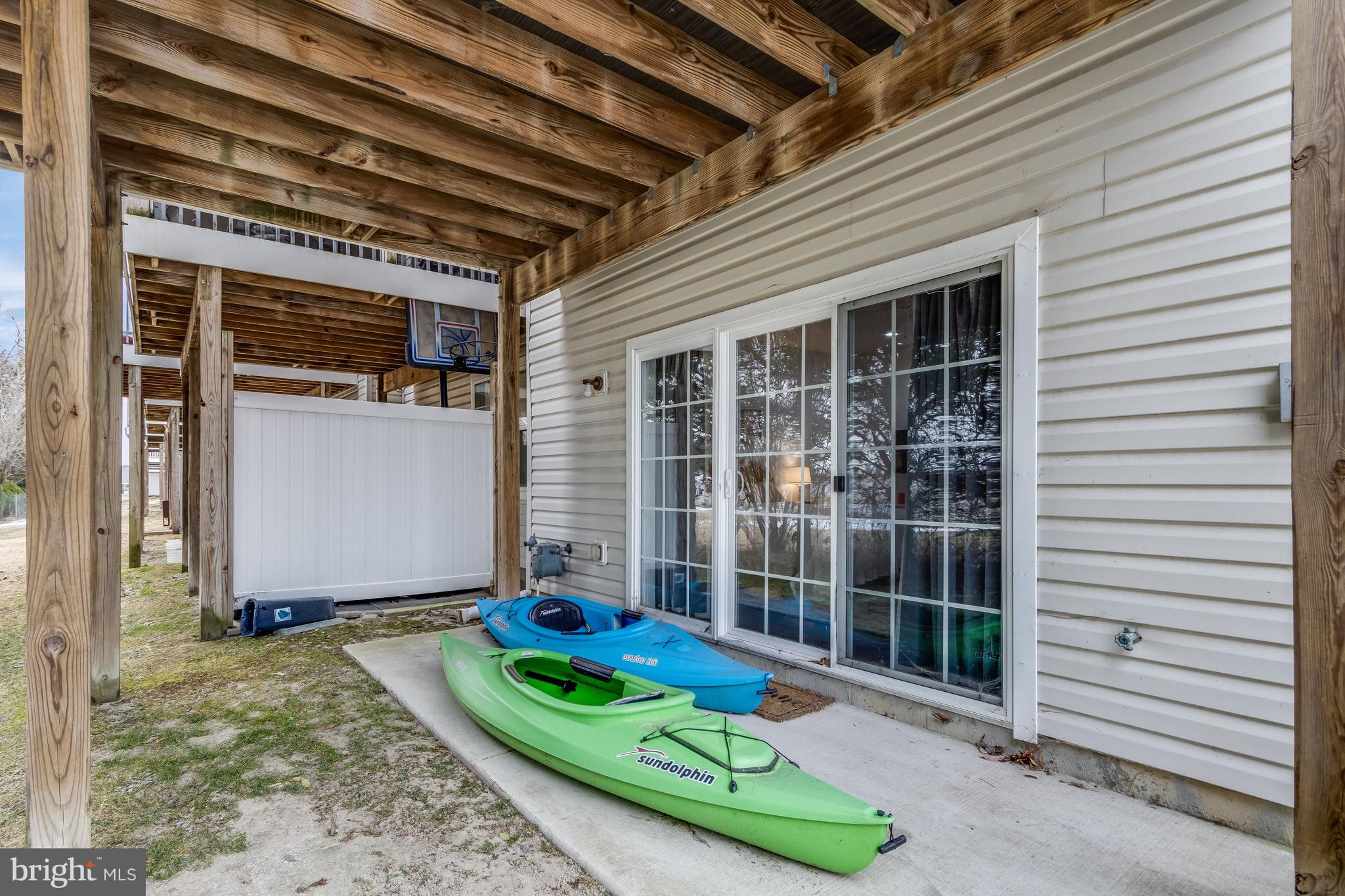 23539 Devonshire Road, Unit 75 Millsboro, DE 19966 - Photo 42 of 48 Rear Yard/ Basement Sliding Door