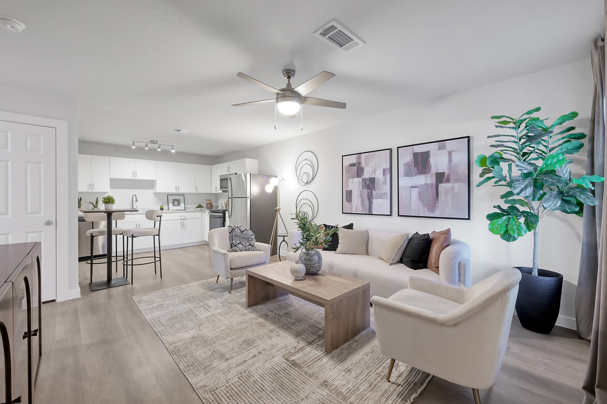 3450 Barker Cypress Road, Unit 2201 Houston, TX 77084 - Photo 1 of 17 a living room with furniture potted plant and open kitchen view