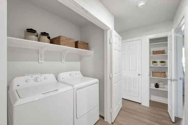 a view of storage and utility room with washer and dryer