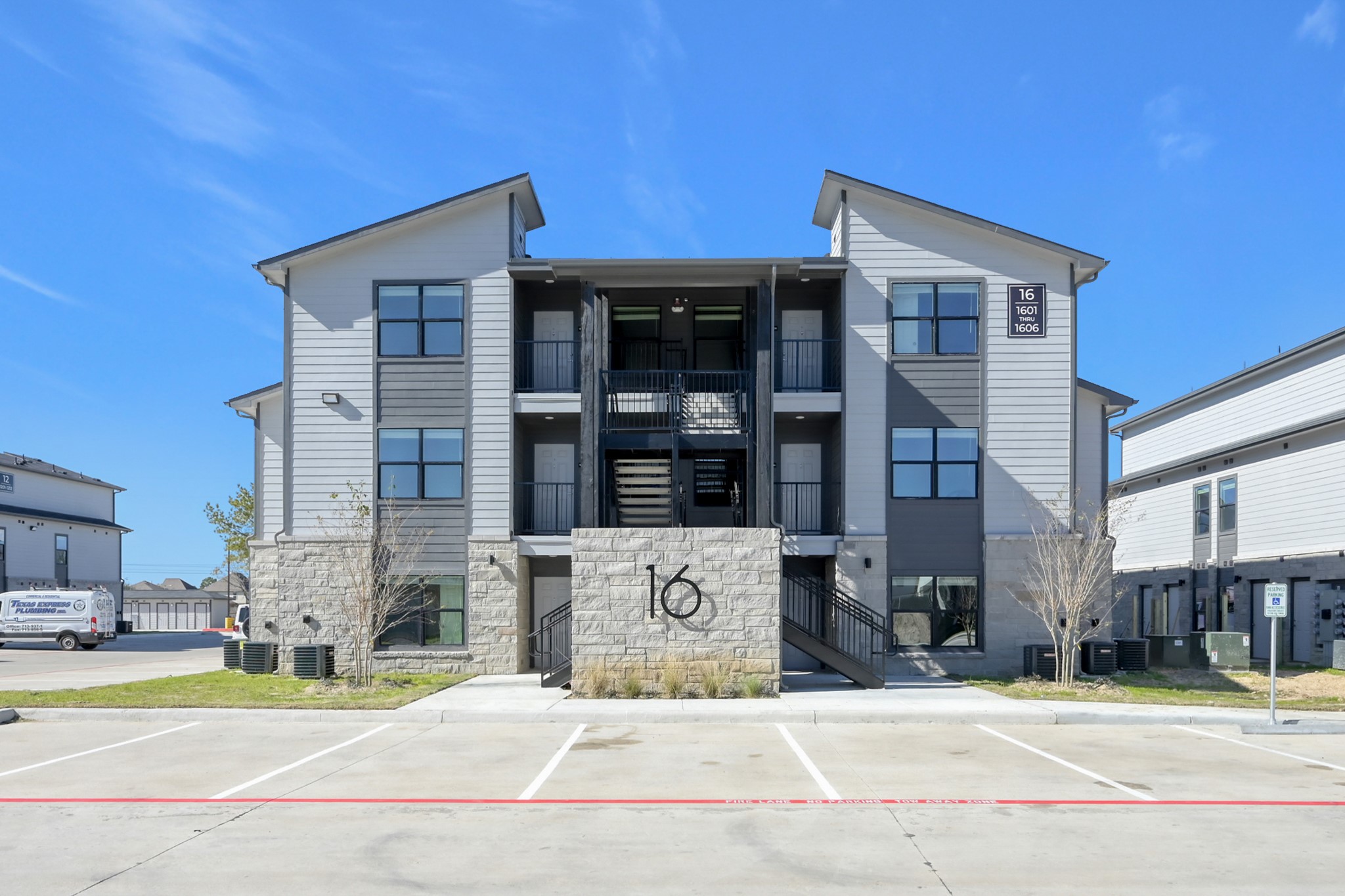 3450 Barker Cypress Road, Unit 2201 Houston, TX 77084 - Photo 16 of 17 a front view of a building with street