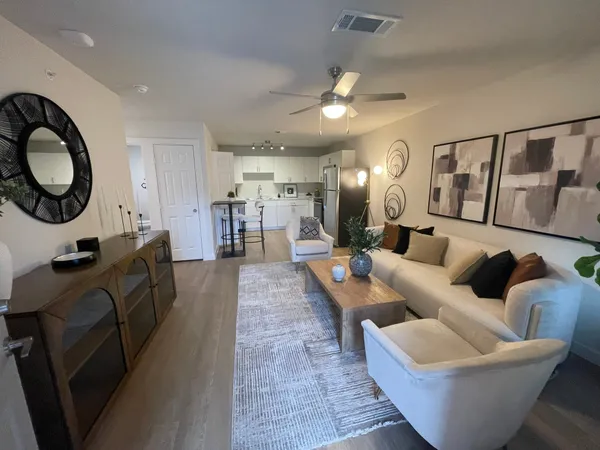 a living room with furniture and a large window