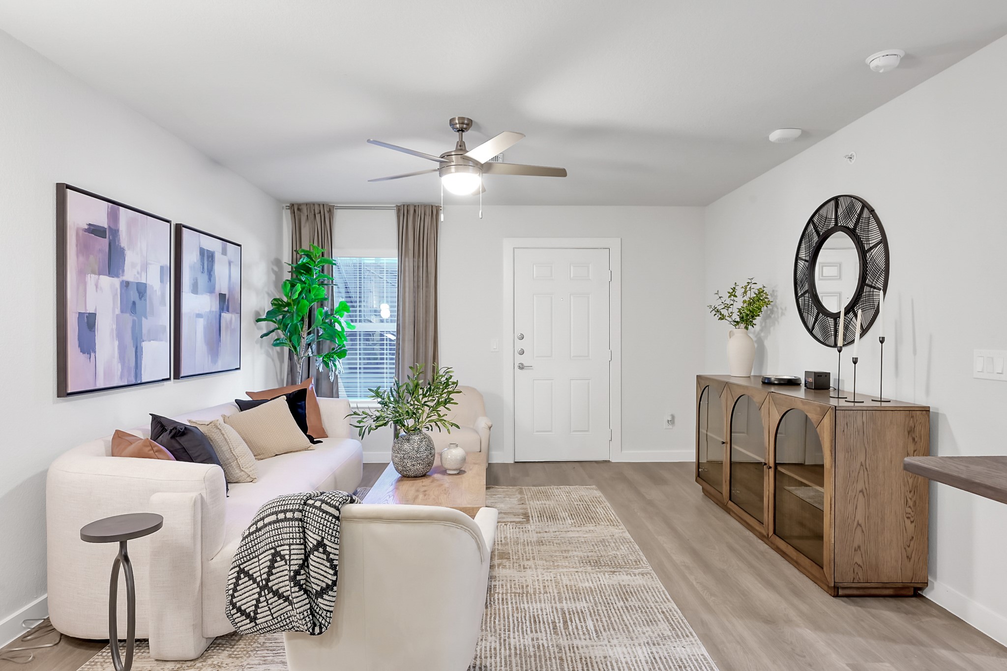 3450 Barker Cypress Road, Unit 2201 Houston, TX 77084 - Photo 2 of 17 a living room with furniture and a large window