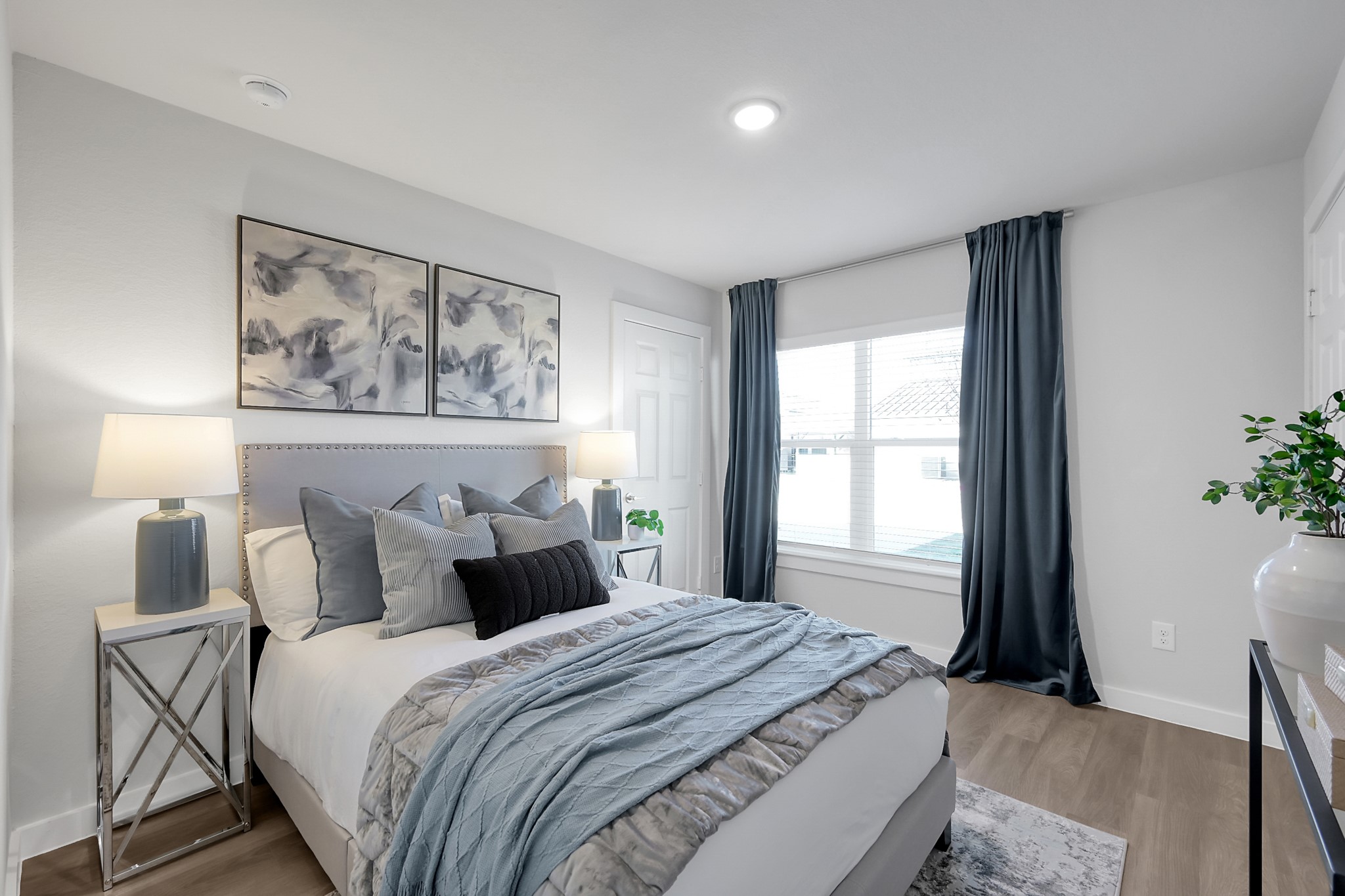 3450 Barker Cypress Road, Unit 2201 Houston, TX 77084 - Photo 7 of 17 a bedroom with a bed and a painting on the wall