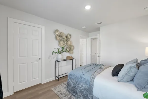 a bedroom with a bed and a table