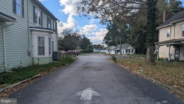 a view of a street with brick building in front of it