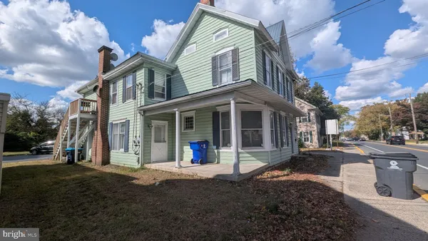a view of a building with a yard