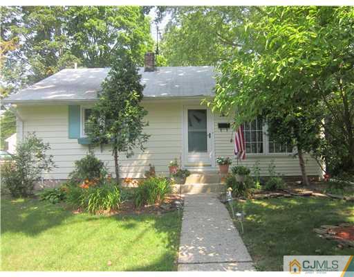 2 Cannon Road East Brunswick, NJ 08816 - Photo 1 of 17 a front view of a house with a yard