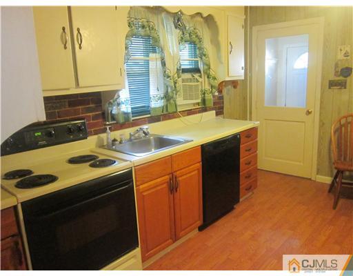 2 Cannon Road East Brunswick, NJ 08816 - Photo 12 of 17 a kitchen that has a sink and a stove