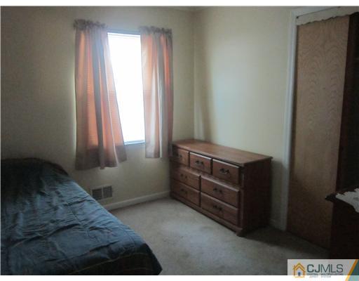 2 Cannon Road East Brunswick, NJ 08816 - Photo 15 of 17 a bedroom with a bed and a window