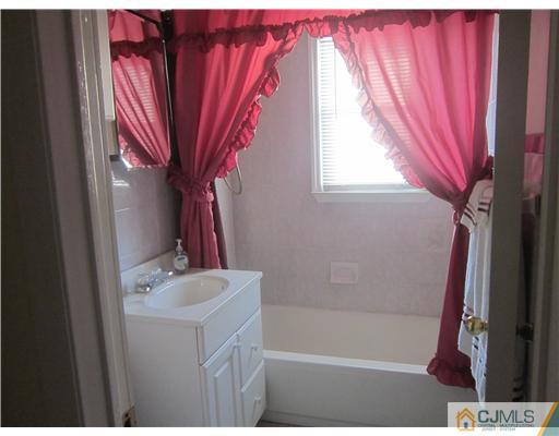 2 Cannon Road East Brunswick, NJ 08816 - Photo 17 of 17 a bath room with a sink and a bath tub