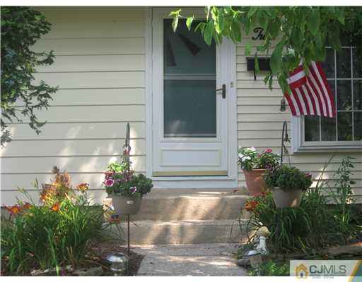 2 Cannon Road East Brunswick, NJ 08816 - Photo 3 of 17 a front view of a house with a yard