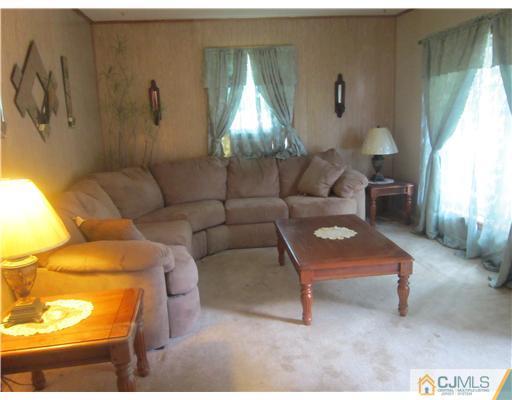 2 Cannon Road East Brunswick, NJ 08816 - Photo 9 of 17 a living room with furniture and a large window