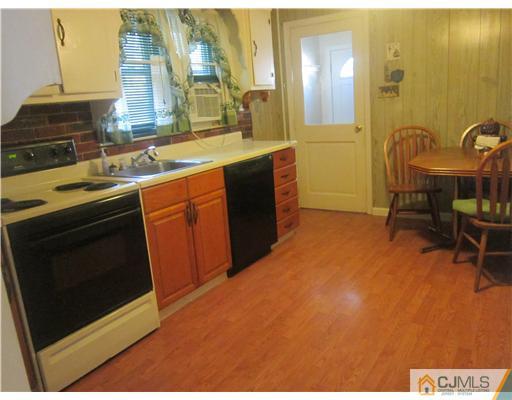 2 Cannon Road East Brunswick, NJ 08816 - Photo 10 of 17 a kitchen with a sink appliances and cabinets