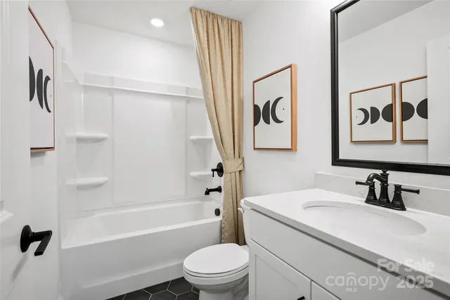 a bedroom with a bed a chair and a dresser