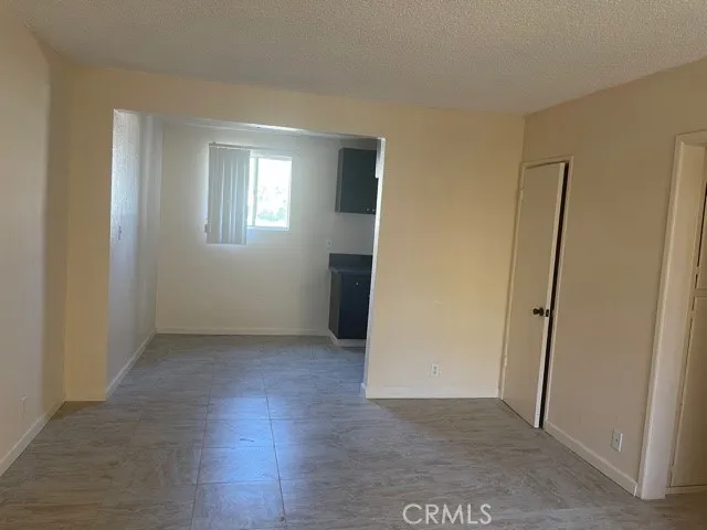 an empty room with a empty space and window