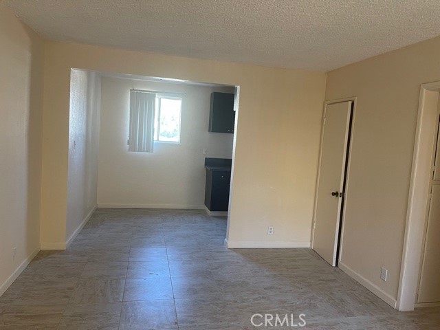 5105 Woodman Avenue, Unit 3 Sherman Oaks, CA 91423 - Photo 11 of 18 an empty room with wooden floor and a window