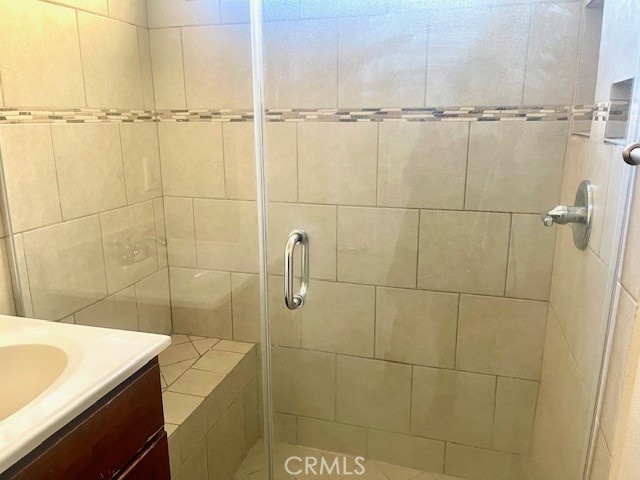 5105 Woodman Avenue, Unit 3 Sherman Oaks, CA 91423 - Photo 13 of 18 a bathroom with a sink and a shower