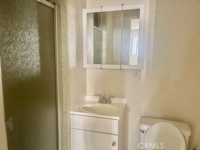 5105 Woodman Avenue, Unit 3 Sherman Oaks, CA 91423 - Photo 15 of 18 a bathroom with a sink a toilet and shower