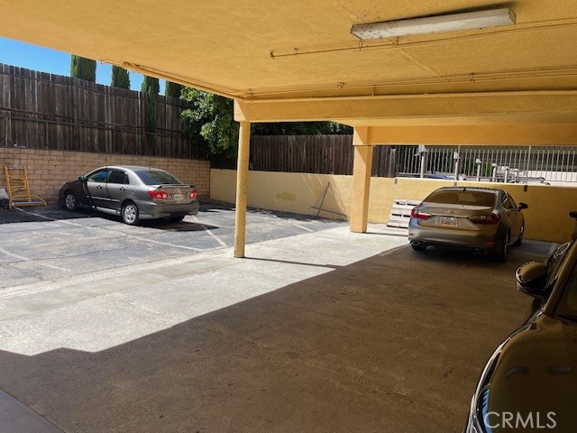 5105 Woodman Avenue, Unit 3 Sherman Oaks, CA 91423 - Photo 16 of 18 a side view of a car parked on the street