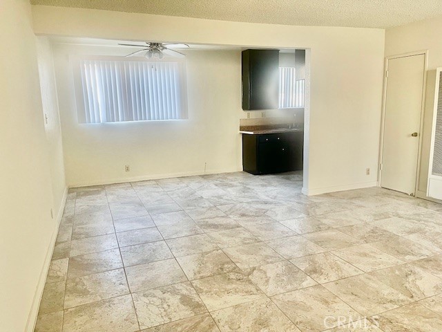 5105 Woodman Avenue, Unit 3 Sherman Oaks, CA 91423 - Photo 4 of 18 a view of an empty room with a kitchen