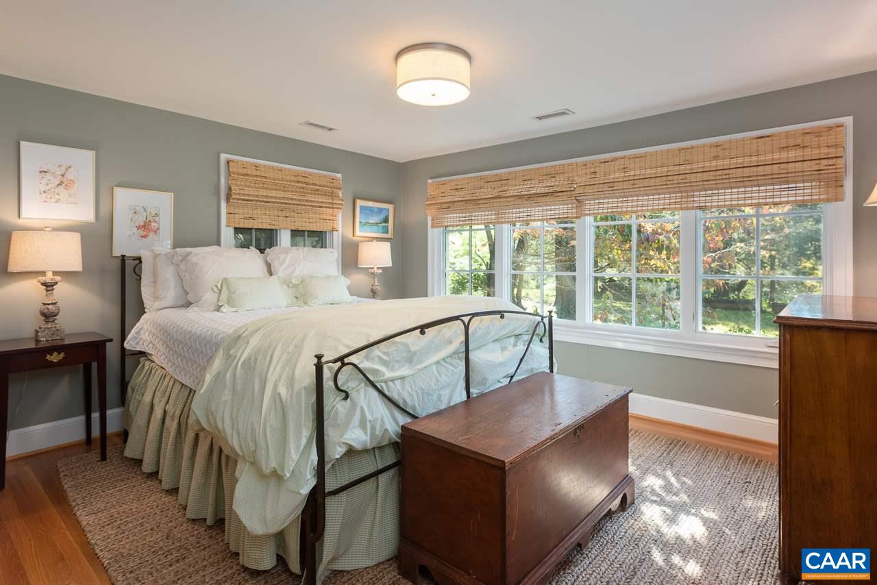 11 Orchard Road Charlottesville, VA 22903 - Photo 32 of 50 a bedroom with a bed and a large window