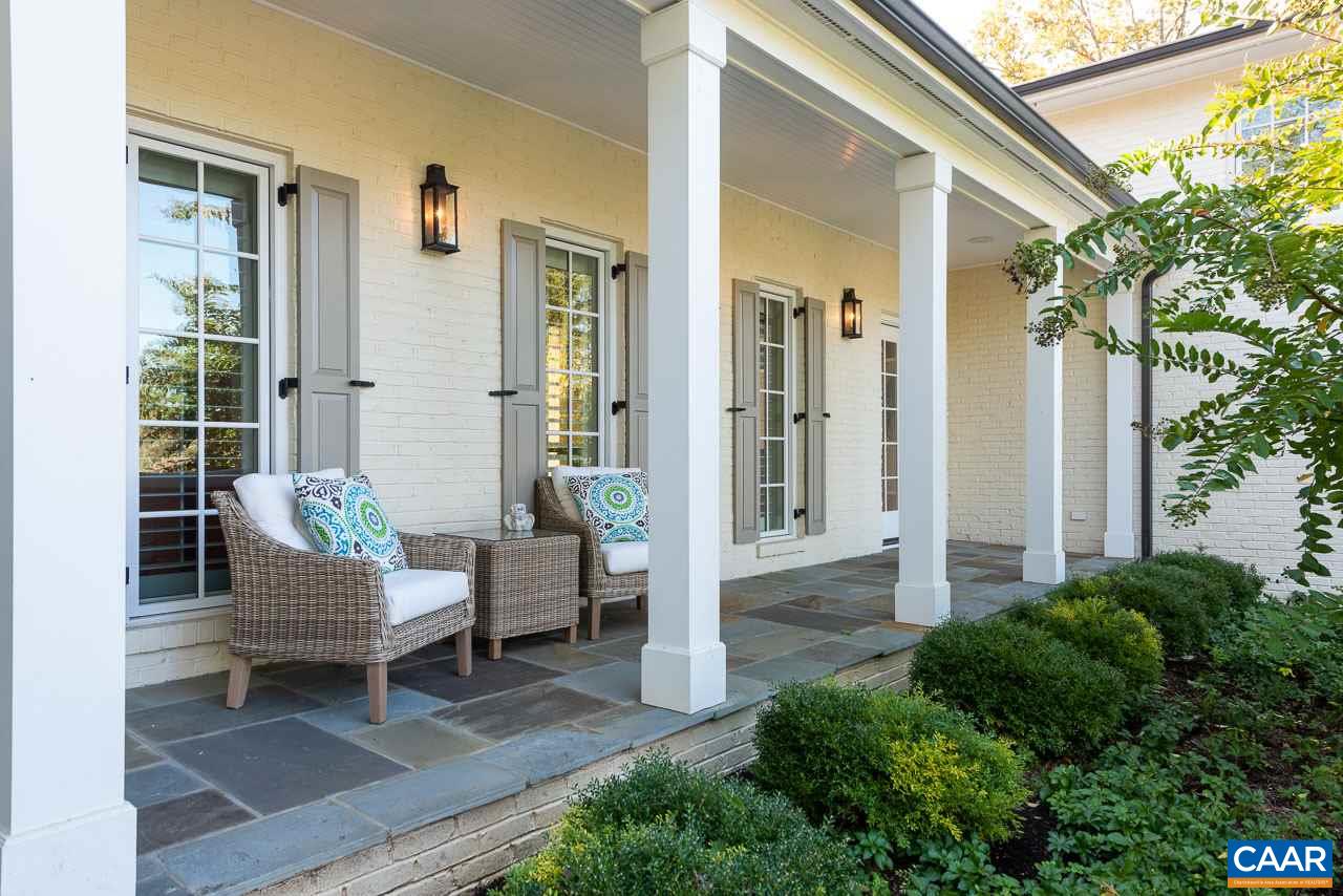 11 Orchard Road Charlottesville, VA 22903 - Photo 4 of 50 a view of a patio with a chairs and table in a patio