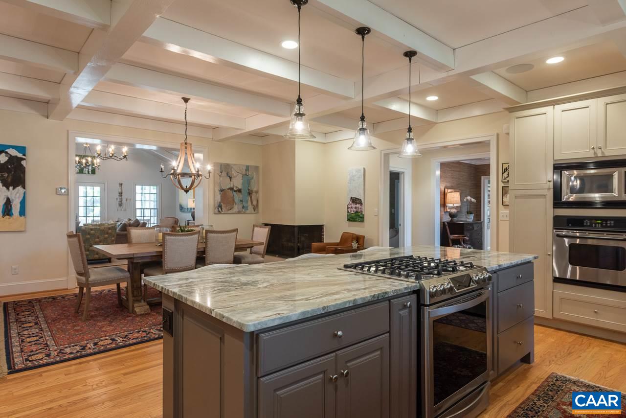 11 Orchard Road Charlottesville, VA 22903 - Photo 8 of 50 a kitchen with a stove a kitchen island a table and chairs