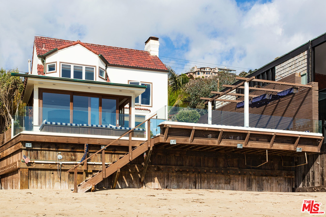 21644 Pacific Coast Highway Malibu, CA 90265 - Photo 15 of 53 a front view of a house with glass windows