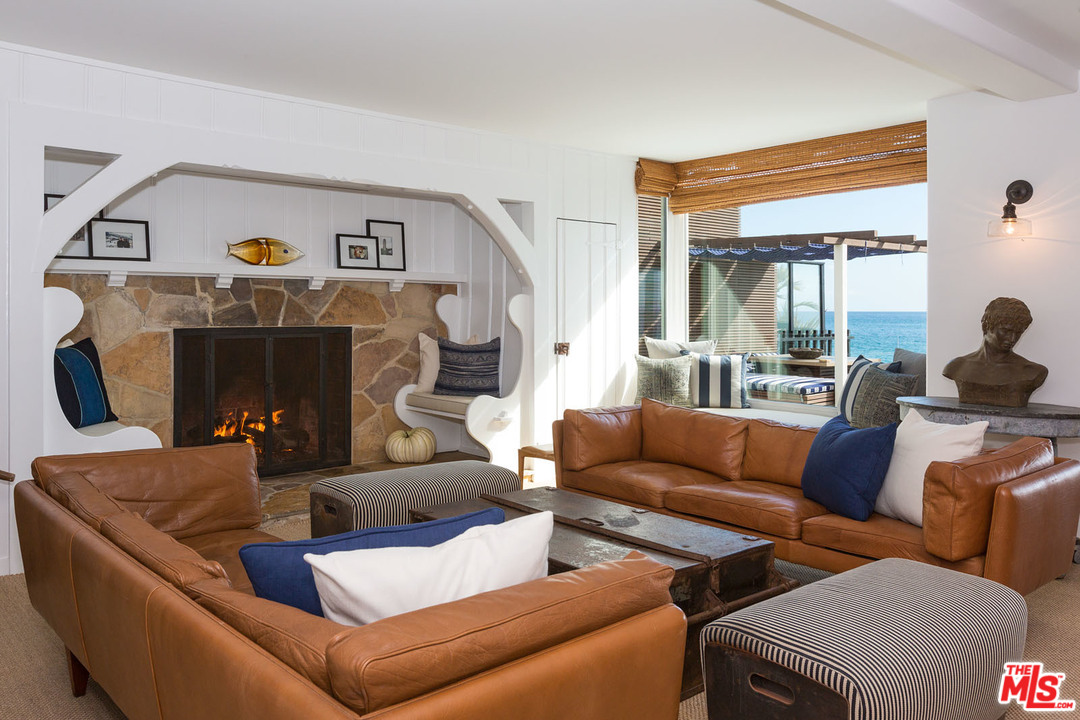 21644 Pacific Coast Highway Malibu, CA 90265 - Photo 20 of 53 a living room with furniture and a fireplace