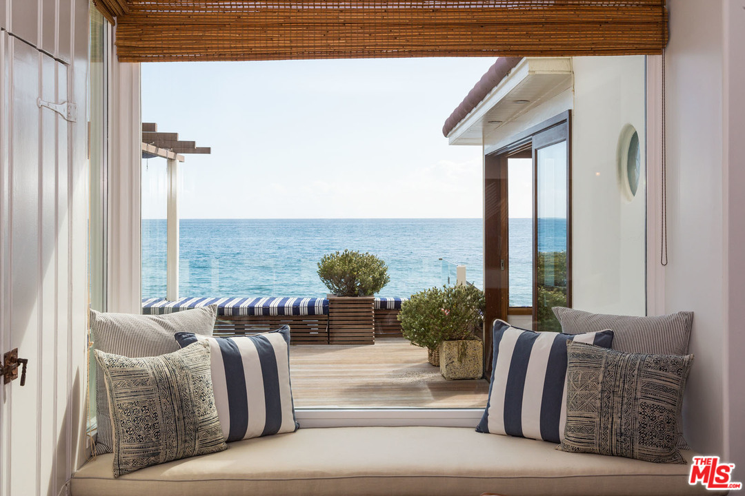21644 Pacific Coast Highway Malibu, CA 90265 - Photo 25 of 53 a balcony with furniture and a potted plant