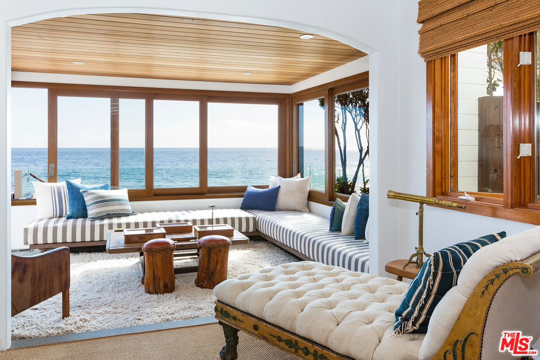 21644 Pacific Coast Highway Malibu, CA 90265 - Photo 26 of 53 a living room with furniture and floor to ceiling windows