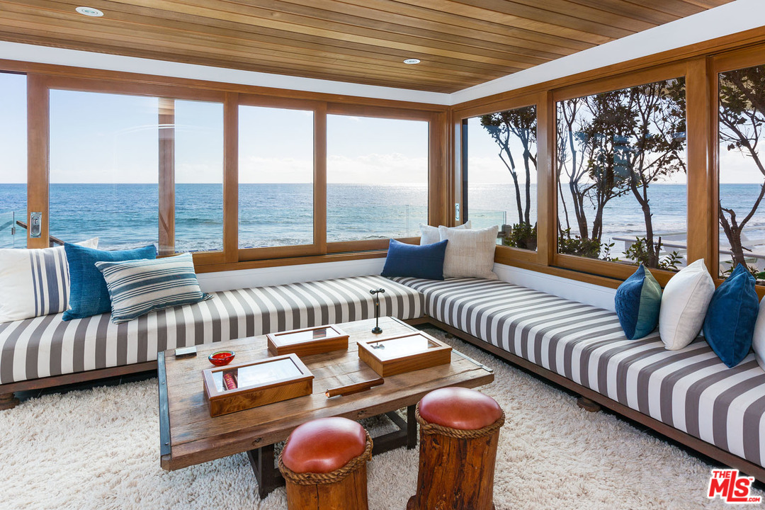 21644 Pacific Coast Highway Malibu, CA 90265 - Photo 28 of 53 a living room with furniture and a large window