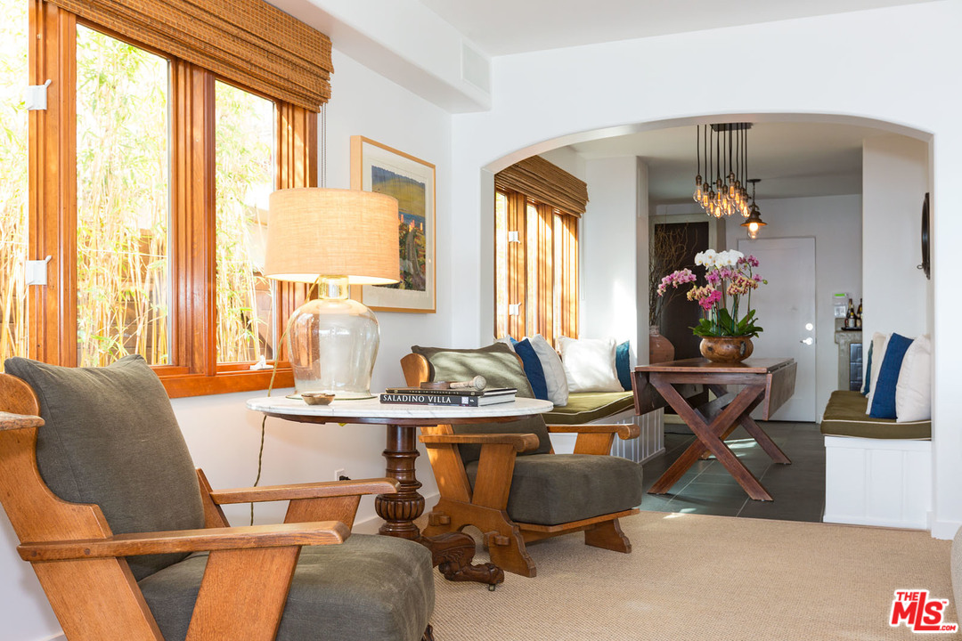21644 Pacific Coast Highway Malibu, CA 90265 - Photo 32 of 53 a view of a dining room with furniture and a potted plant