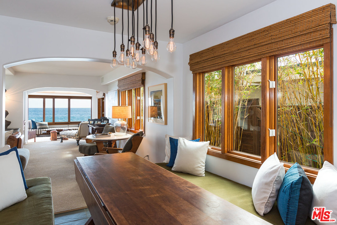 21644 Pacific Coast Highway Malibu, CA 90265 - Photo 35 of 53 a living room with furniture and a chandelier