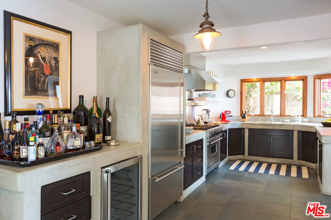 21644 Pacific Coast Highway Malibu, CA 90265 - Photo 37 of 53 a kitchen with a refrigerator and a sink