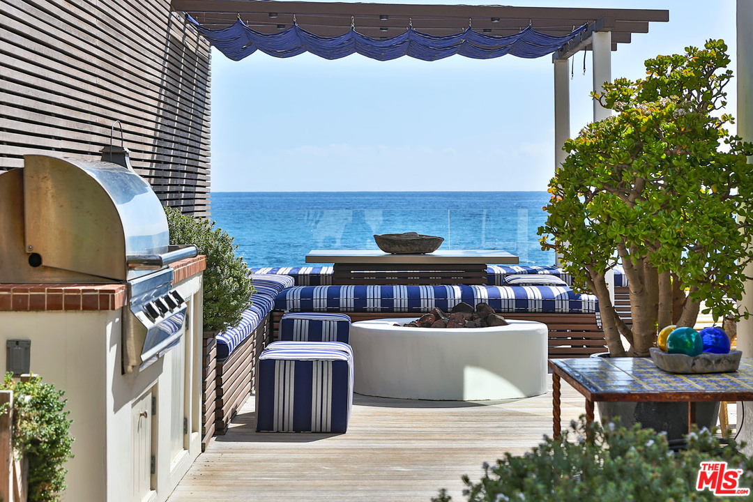 21644 Pacific Coast Highway Malibu, CA 90265 - Photo 5 of 53 a view of a chairs and table on the terrace