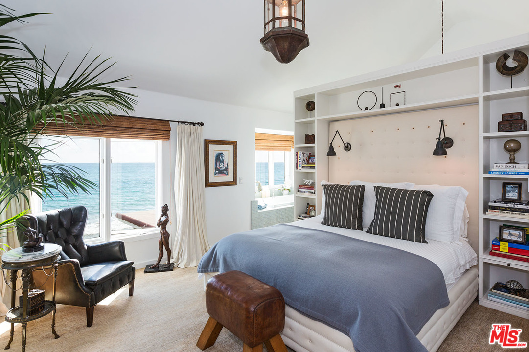 21644 Pacific Coast Highway Malibu, CA 90265 - Photo 45 of 53 a bedroom with a large bed and a couch